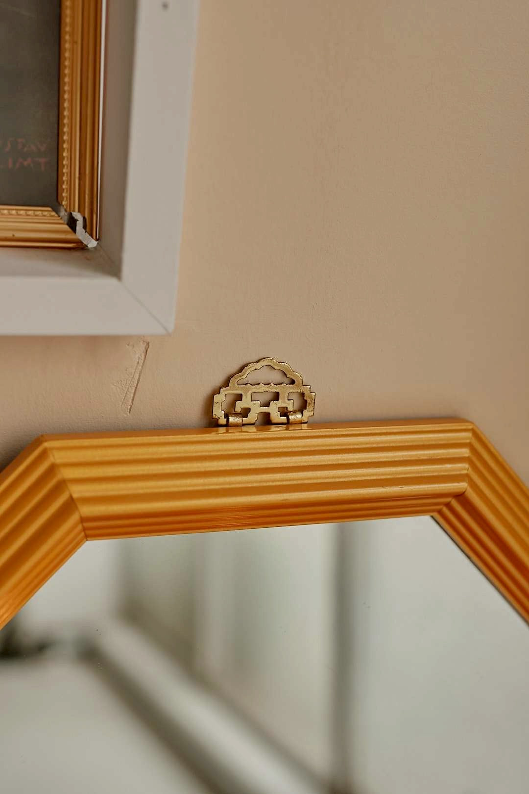 Octagonal gold mirror